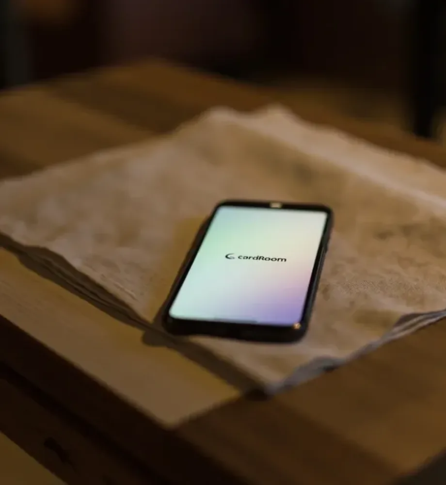 Square photograph of a smartphone resting on folded linen for a device-verification check