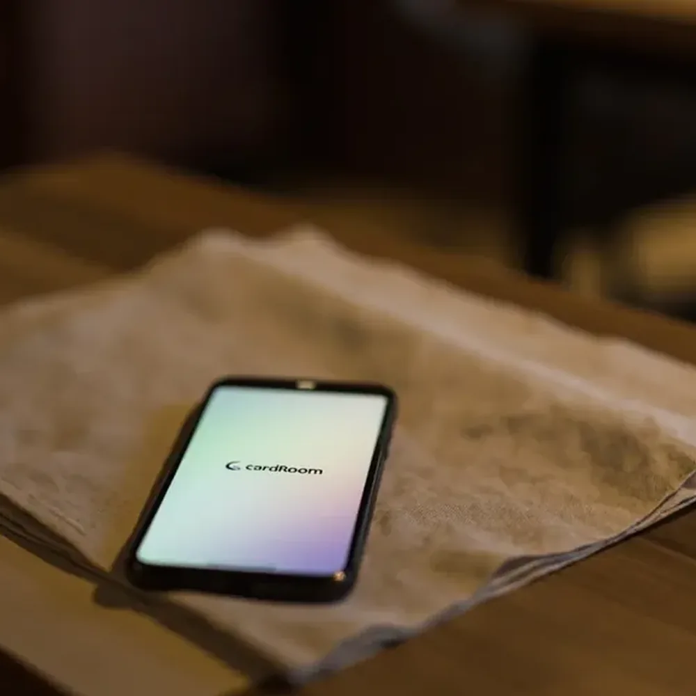 Square photograph of a smartphone resting on folded linen for an account-protection check